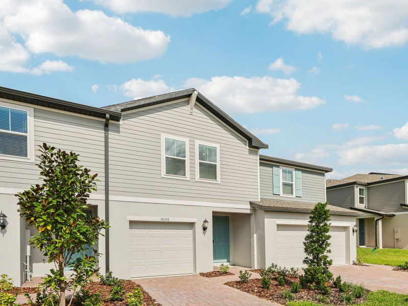 Front exterior of a new home in Cagan Crossings West, Clermont, FL, highlighting curb appeal (Image 1). Front exterior of a new home in Cagan Crossings West, Clermont, FL, highlighting curb appeal (Image 1).