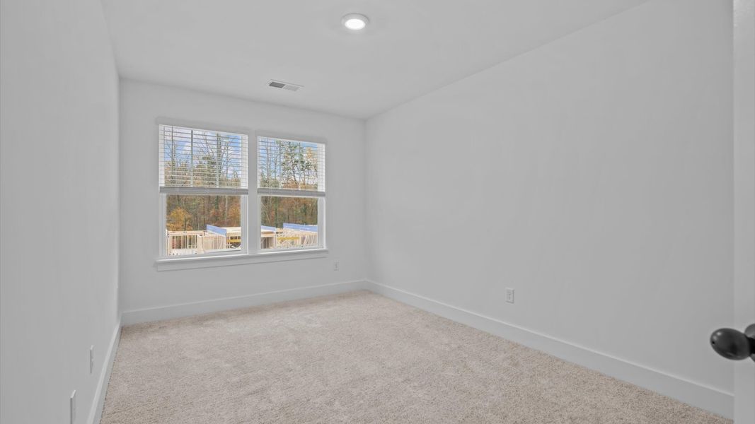 Superior comfort in this light-filled bedroom with plush carpeting and thoughtfully placed large windows Superior comfort in this light-filled bedroom with plush carpeting and thoughtfully placed large windows