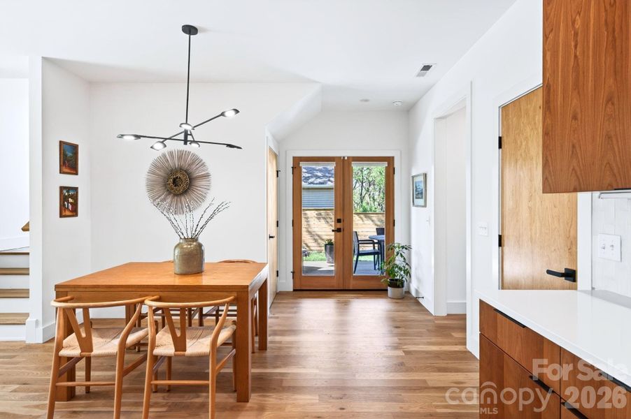 Glass French Doors Open to Covered Patio