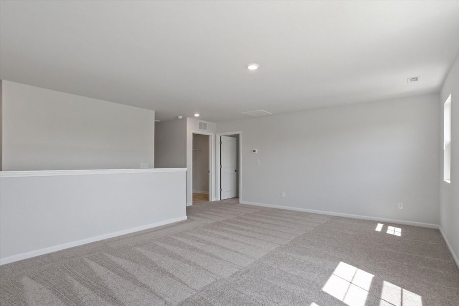 Spacious, unfurnished interior of a new home in Cambridge Reserve, Angier (Image 24).