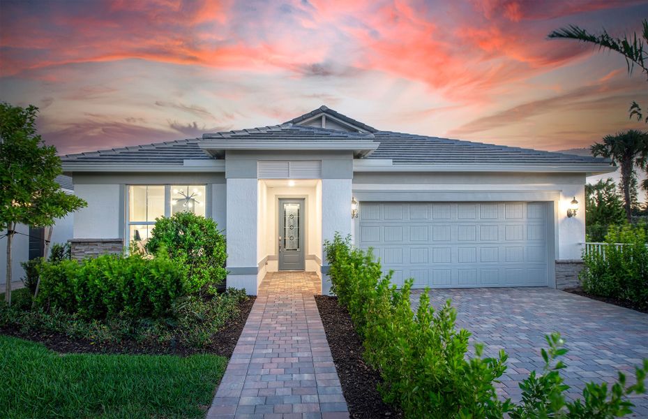 Front exterior of a new home in Costa Pointe, Vero Beach, FL, highlighting curb appeal (Image 21). Front exterior of a new home in Costa Pointe, Vero Beach, FL, highlighting curb appeal (Image 21).