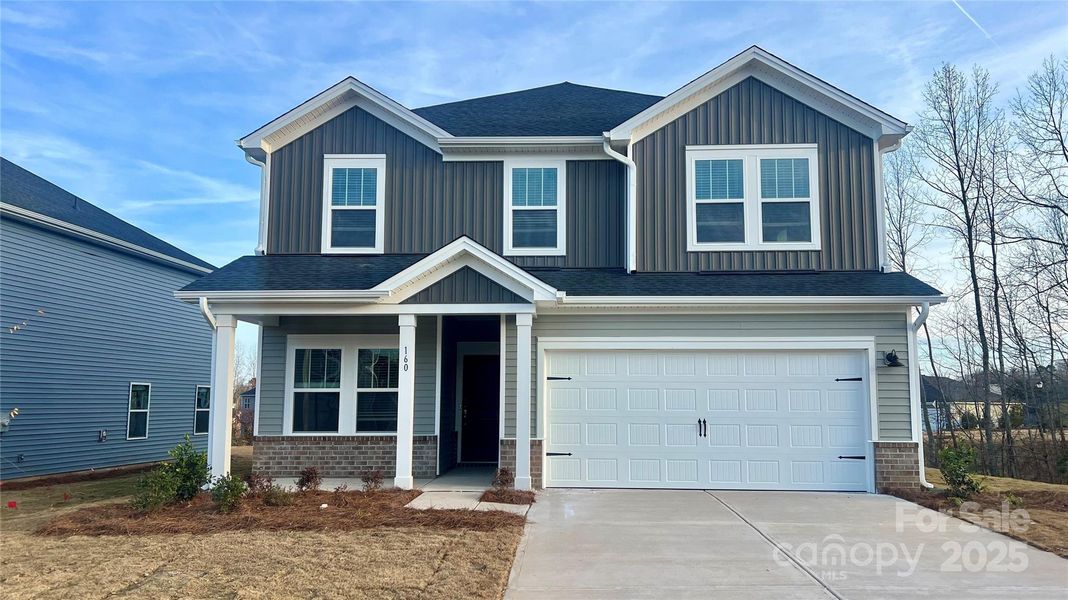 Front exterior of a new home in Nelson's Creek, Mocksville, NC, highlighting curb appeal (Image 2).