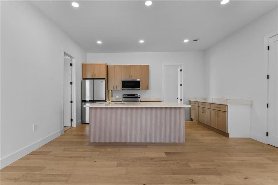 Interior and exterior entry points. one bedroom guest suite with kitchen, en suite bath, walk in closet and pantry. Perfect for multi generational living or guests