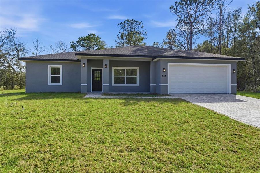 Front exterior of a new home in , Citrus Springs, FL, highlighting curb appeal (Image 18).