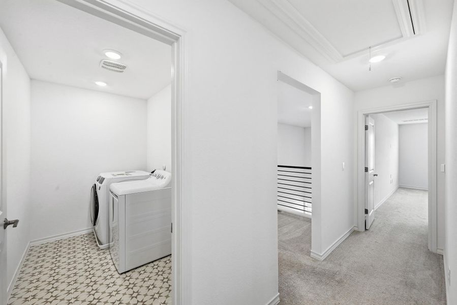 Laundry area with washing machine and clothes dryer and recessed lighting