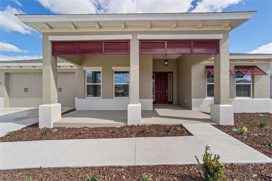 Exterior details and patio area of a home in On Top of the World Communities, Ocala (Image 3).