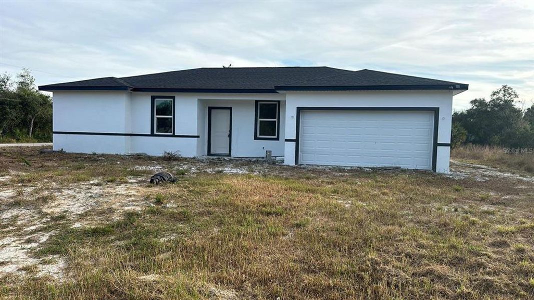 Front exterior of a new home in , Port Charlotte, FL, highlighting curb appeal (Image 20).