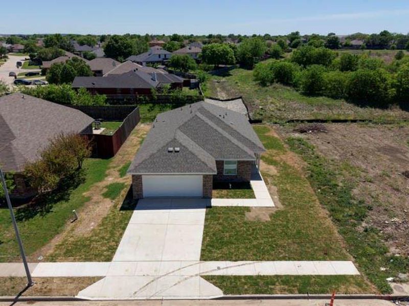 Front exterior of a new home in , Fort Worth, TX, highlighting curb appeal (Image 16).