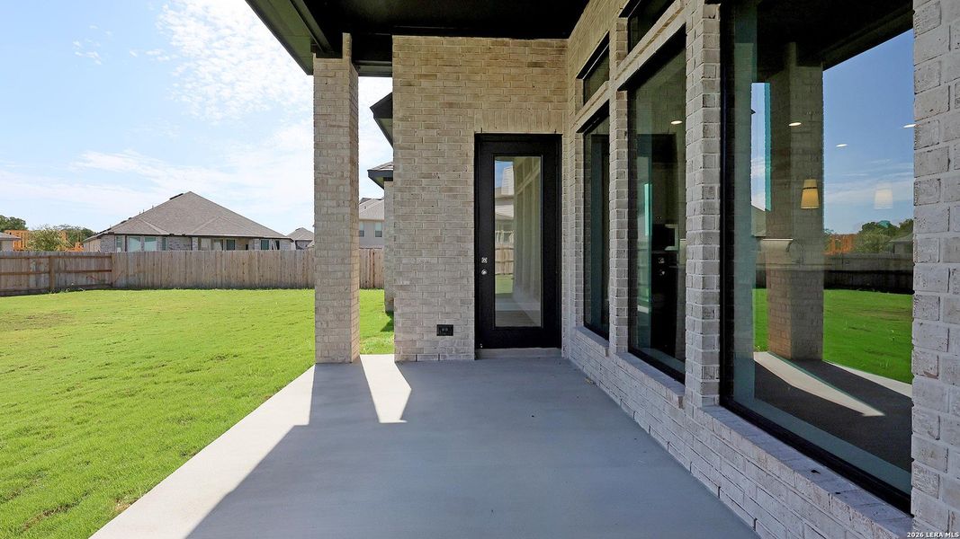 Exterior details and patio area of a home in Alsatian Oaks, Castroville (Image 4).