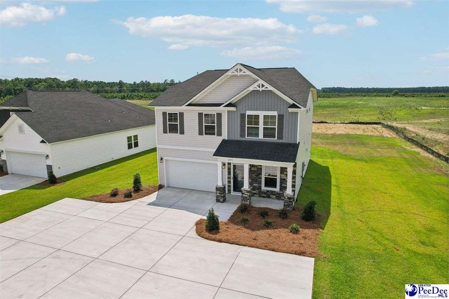 Front exterior of a new home in Southern Columns, Florence, SC, highlighting curb appeal (Image 25).