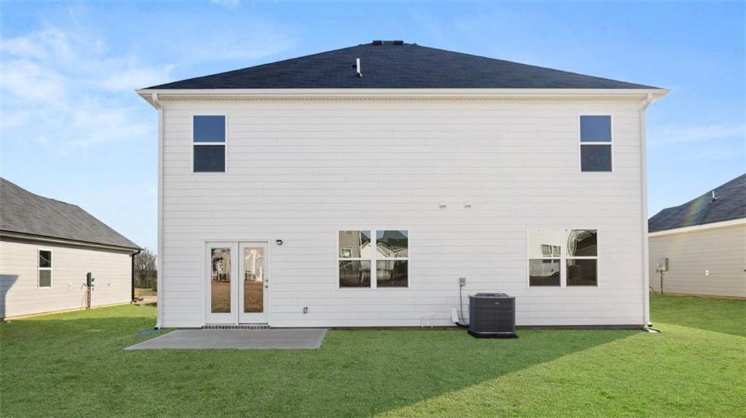 Exterior details and patio area of a home in The Preserve at Agricultural Village, Perry (Image 4).