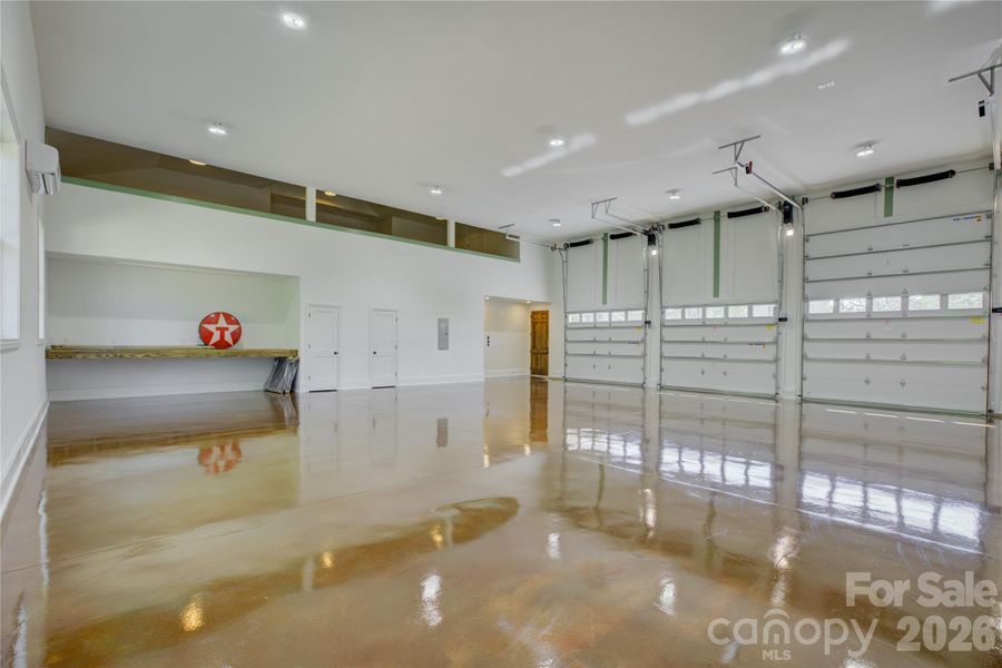 Heated and cooled 2000 SqFt garage with a loft