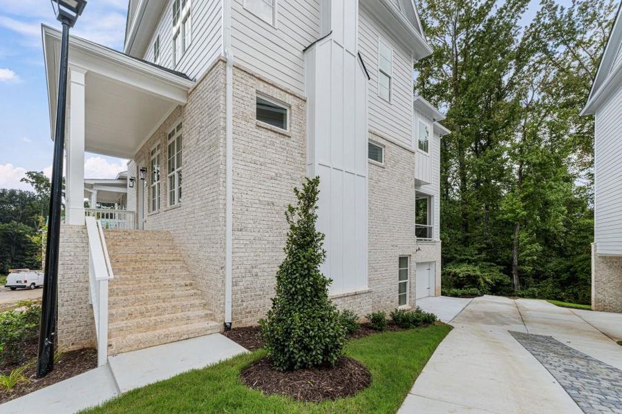 Front exterior of a new home in Parkside Roswell, Roswell, GA, highlighting curb appeal (Image 1).