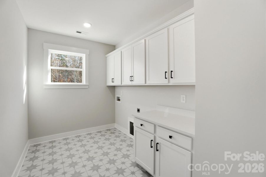 Laundry room with cabinets