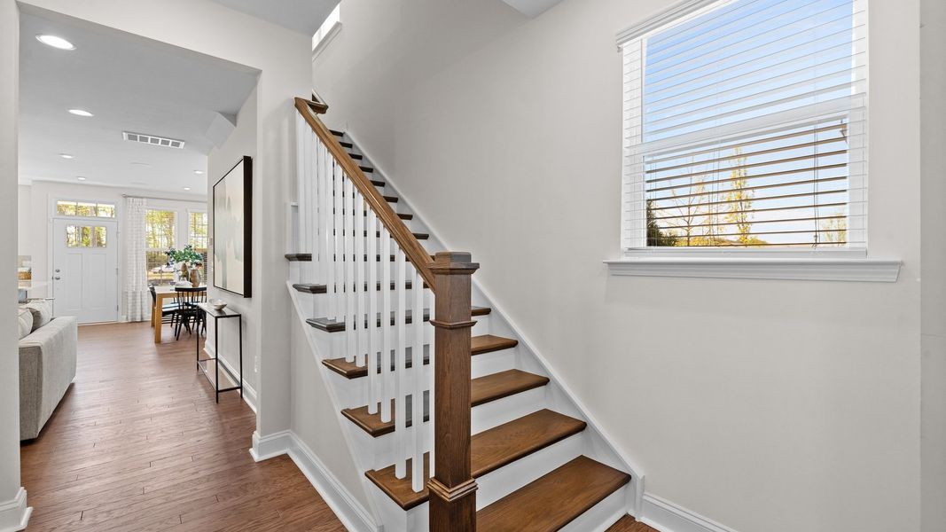 Ample spaces and wide entry solid oak treads stairs with open rails in the Rochester Design by DRB Homes Charlotte, NC Ample spaces and wide entry solid oak treads stairs with open rails in the Rochester Design by DRB Homes Charlotte, NC