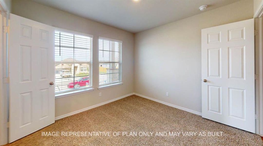 Carpeted spare room with baseboards and a smoke detector Carpeted spare room with baseboards and a smoke detector