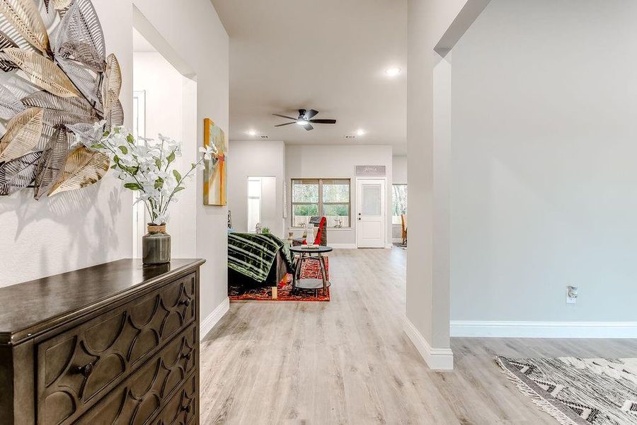 Hallway featuring light wood-type flooring