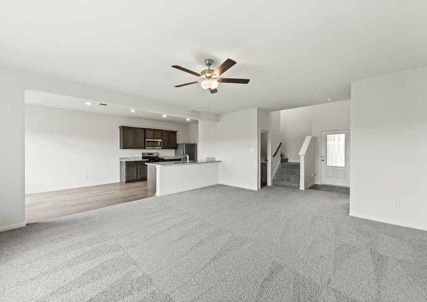 The open layout connects the kitchen with the dining room and family room.