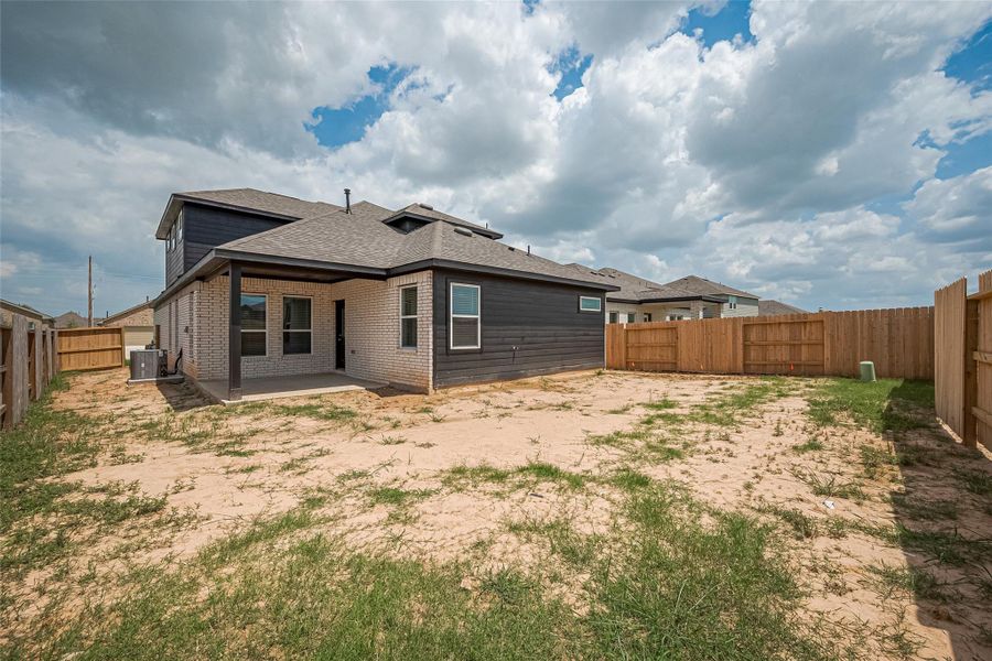 Exterior details and patio area of a home in Sunterra, Katy (Image 1).