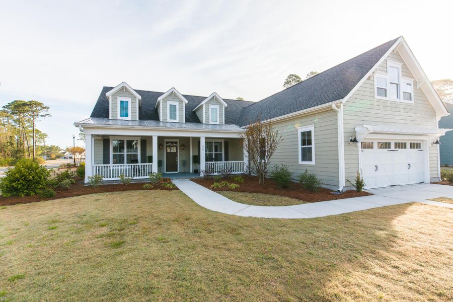 Representative exterior photo of a completed home built from the McKinley by Bill Clark Homes in The Sanctuary at Sunset Beach, Sunset Beach, NC (Image 26). Representative exterior photo of a completed home built from the McKinley by Bill Clark Homes in The Sanctuary at Sunset Beach, Sunset Beach, NC (Image 26).