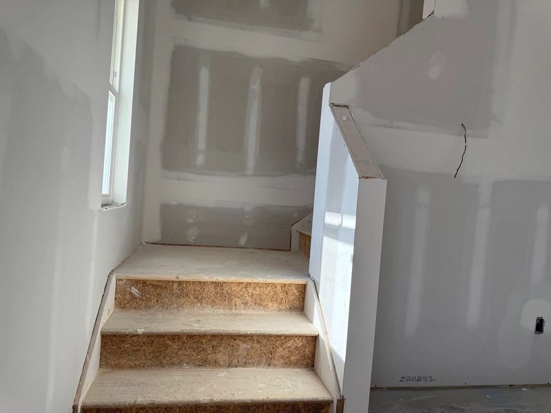 Staircase featuring the AW Collection® Coastal - Clean lines and light finishes