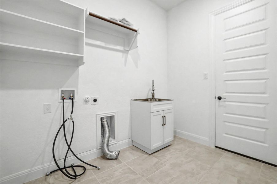 Laundry area with hookup for a washing machine and hookup for an electric dryer
