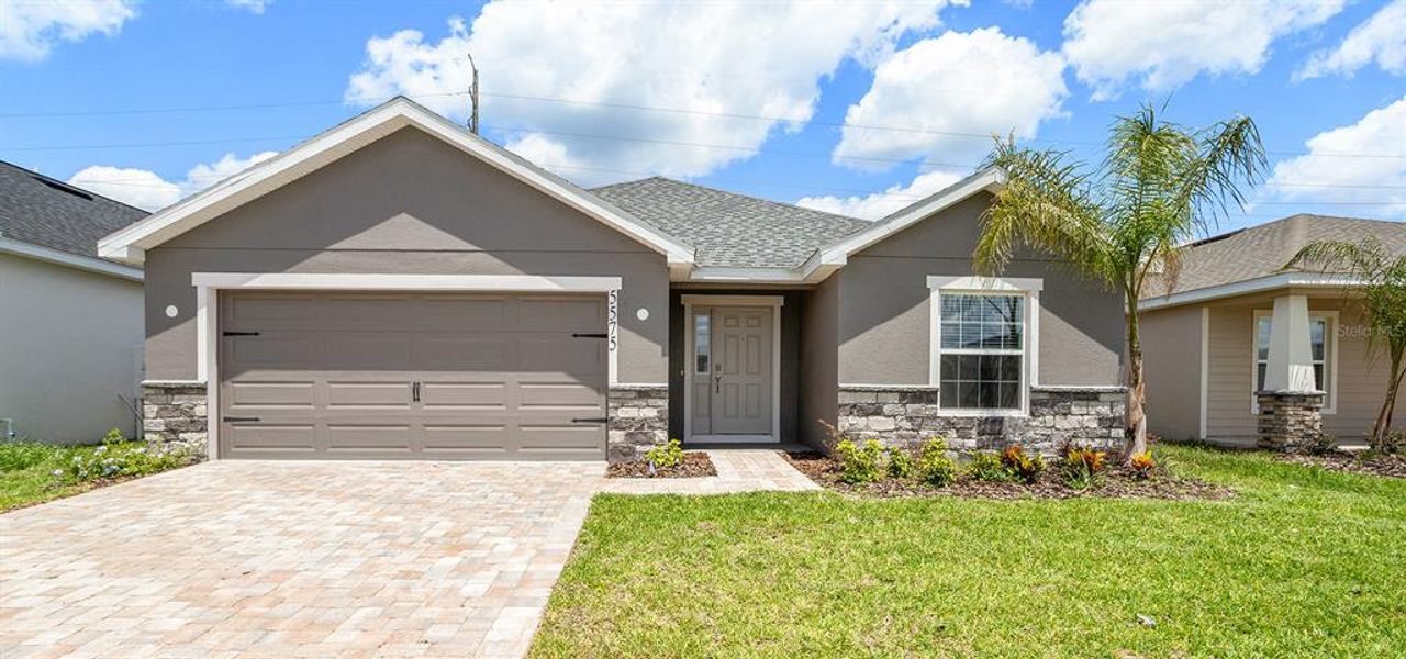 Front exterior of a new home in Estates at Hickory Cove - Single-Family Homes, St. Cloud, FL, highlighting curb appeal (Image 1). Front exterior of a new home in Estates at Hickory Cove - Single-Family Homes, St. Cloud, FL, highlighting curb appeal (Image 1).