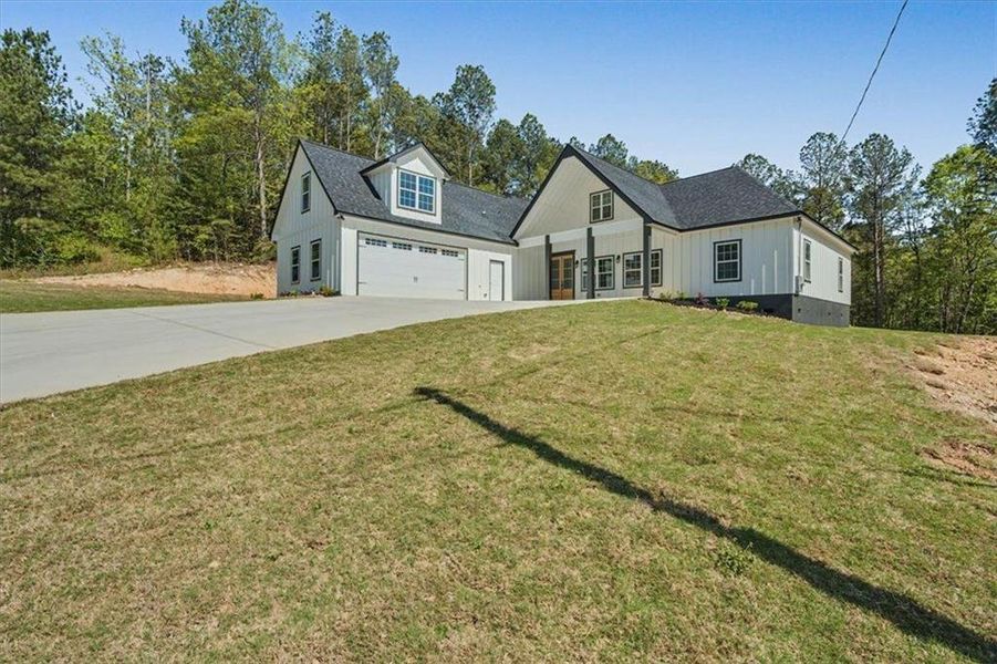 Front exterior of a new home in , Lindale, GA, highlighting curb appeal (Image 26).