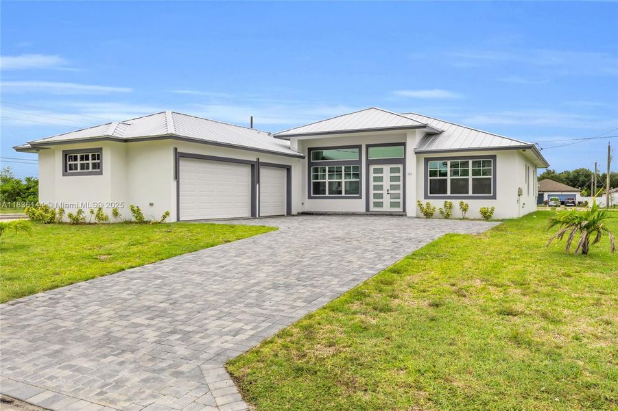 Front exterior of a new home in , Port St. Lucie, FL, highlighting curb appeal (Image 27).