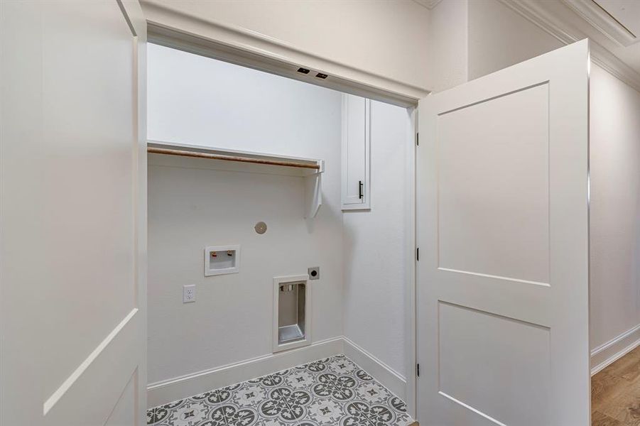 Clothes washing area featuring baseboards, washer hookup, laundry area, and electric dryer hookup Clothes washing area featuring baseboards, washer hookup, laundry area, and electric dryer hookup