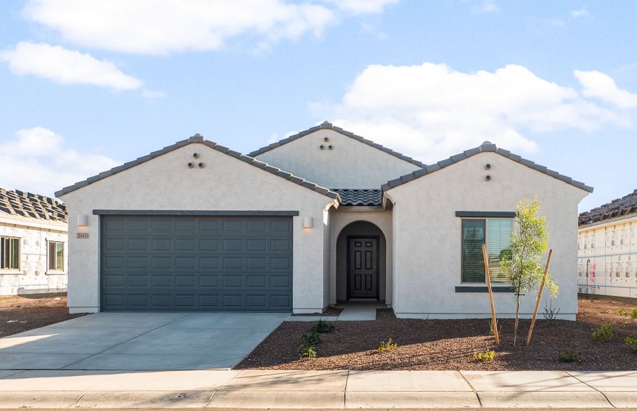 Front exterior of a new home in Copper Falls, Buckeye, AZ, highlighting curb appeal (Image 15).