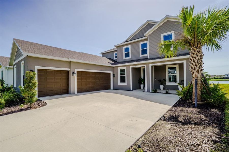 Front exterior of a new home in , Sarasota, FL, highlighting curb appeal (Image 22). Front exterior of a new home in , Sarasota, FL, highlighting curb appeal (Image 22).