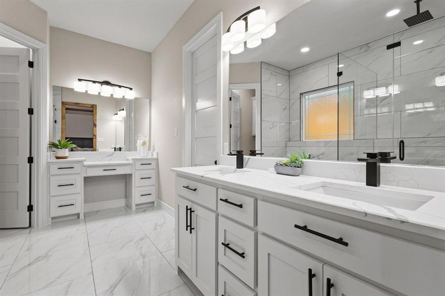 Full bathroom featuring light marble finish flooring, a marble finish shower, double vanity, and recessed lighting
