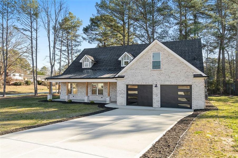Front exterior of a new home in , Snellville, GA, highlighting curb appeal (Image 25).