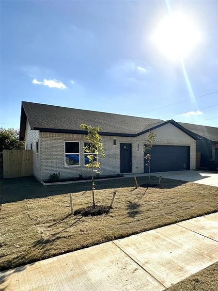 View of front of home featuring a garage