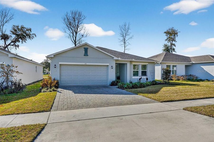 Front exterior of a new home in , Edgewater, FL, highlighting curb appeal (Image 2). Front exterior of a new home in , Edgewater, FL, highlighting curb appeal (Image 2).