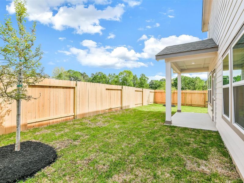 Exterior details and patio area of a home in Caney Creek Place, Conroe (Image 25).