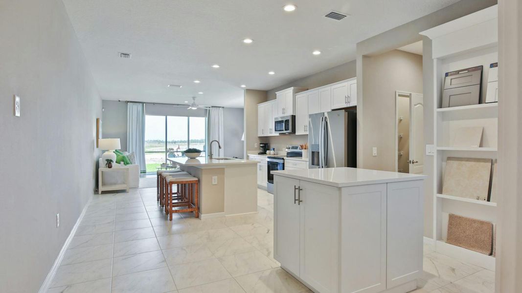 Furnished interior view inside a new home in Palm Grove Real Estate and Homes for Sale in Lakewood Ranch, FL - Neal Communities, Lakewood Ranch (Image 6).