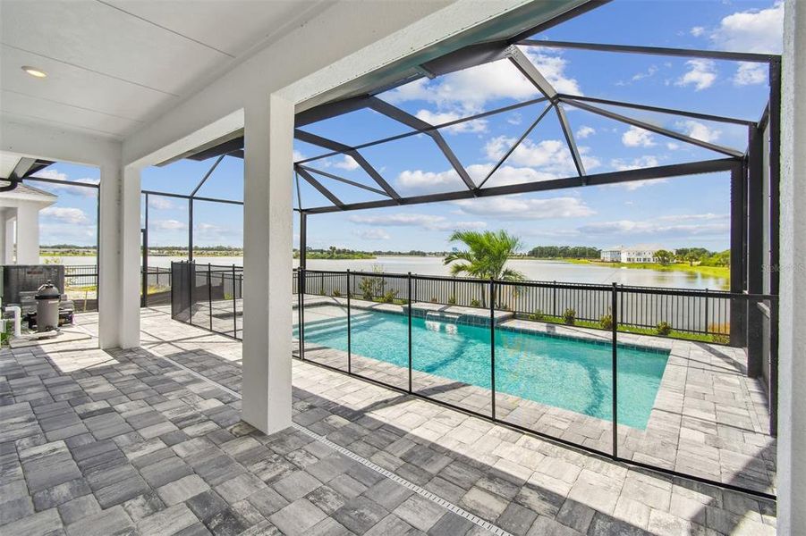 Exterior details and patio area of a home in Emerald Landing at Waterside at Lakewood Ranch – Lake Series, Sarasota (Image 3).