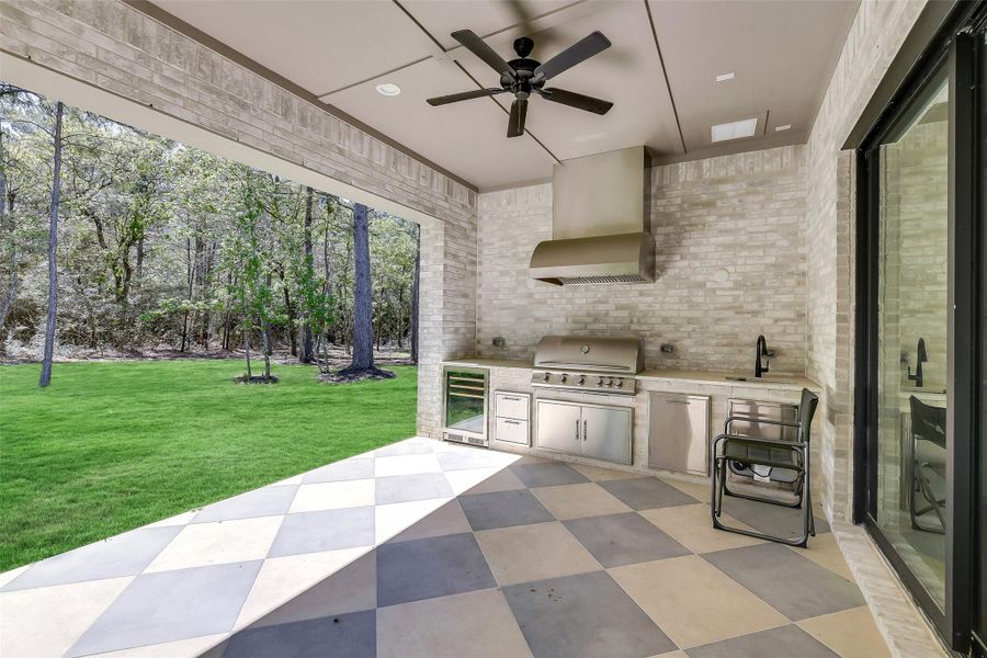 Patio with outdoor kitchen outside by breakfast area