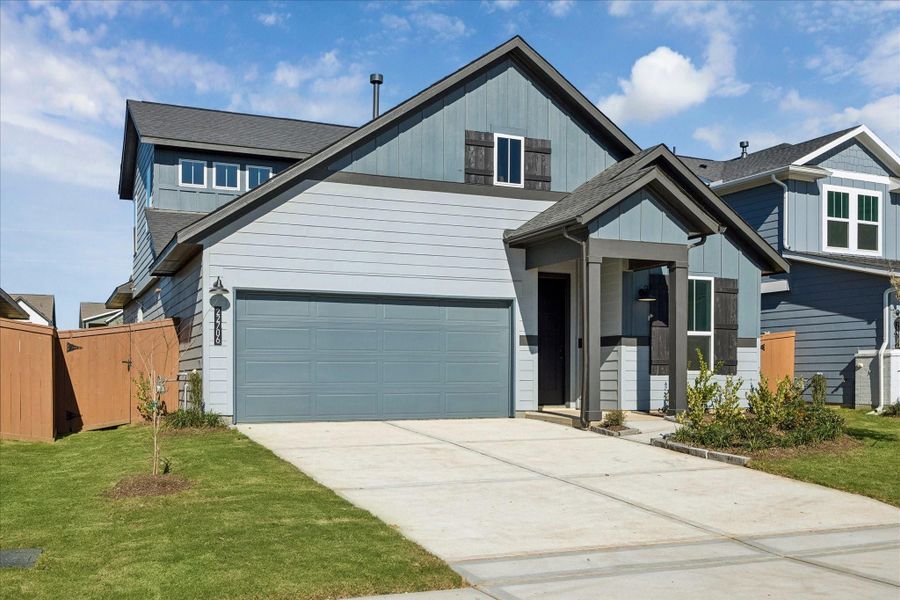 Front exterior of a new home in Elyson, Katy, TX, highlighting curb appeal (Image 2). Front exterior of a new home in Elyson, Katy, TX, highlighting curb appeal (Image 2).
