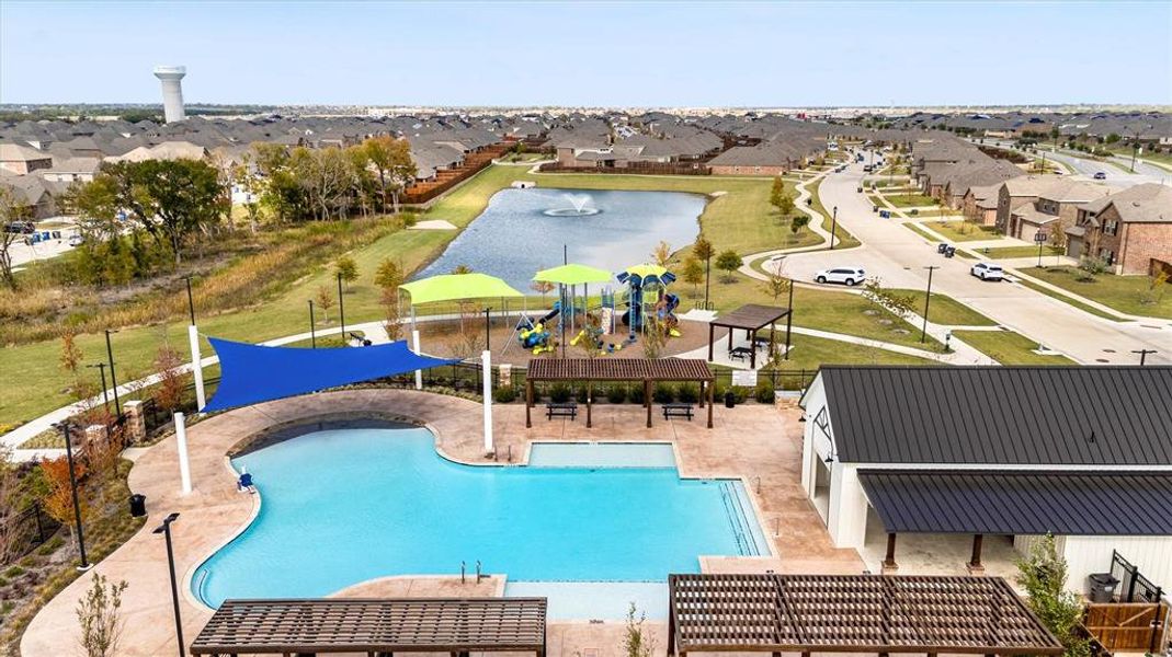 Community pool with a residential view, a water view, a water play area, and a patio area