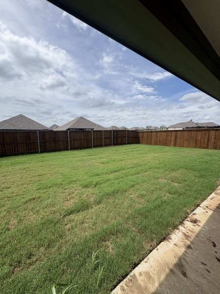 Exterior details and patio area of a home in Stillwater Lake Estates, Godley (Image 14).