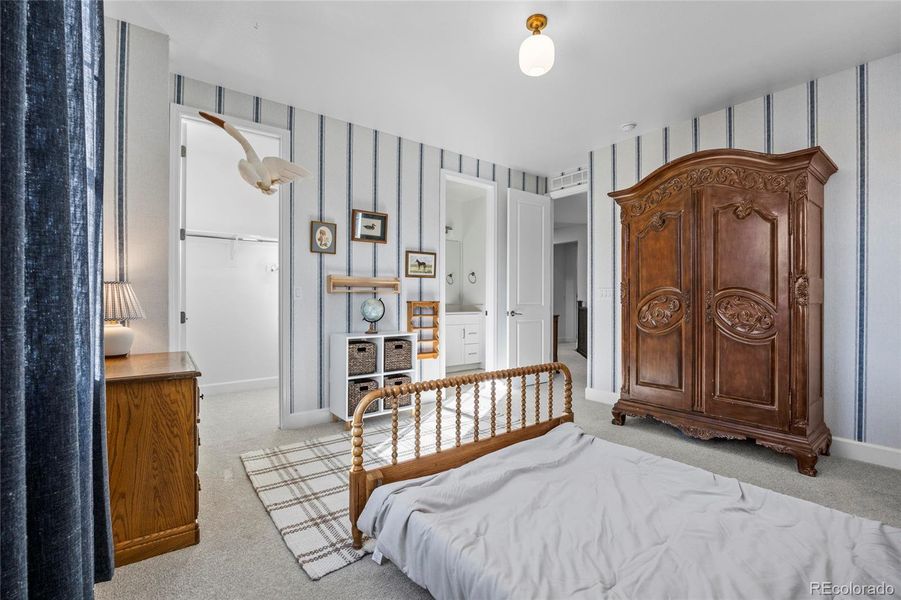 Large walk-in closet in secondary bedroom
