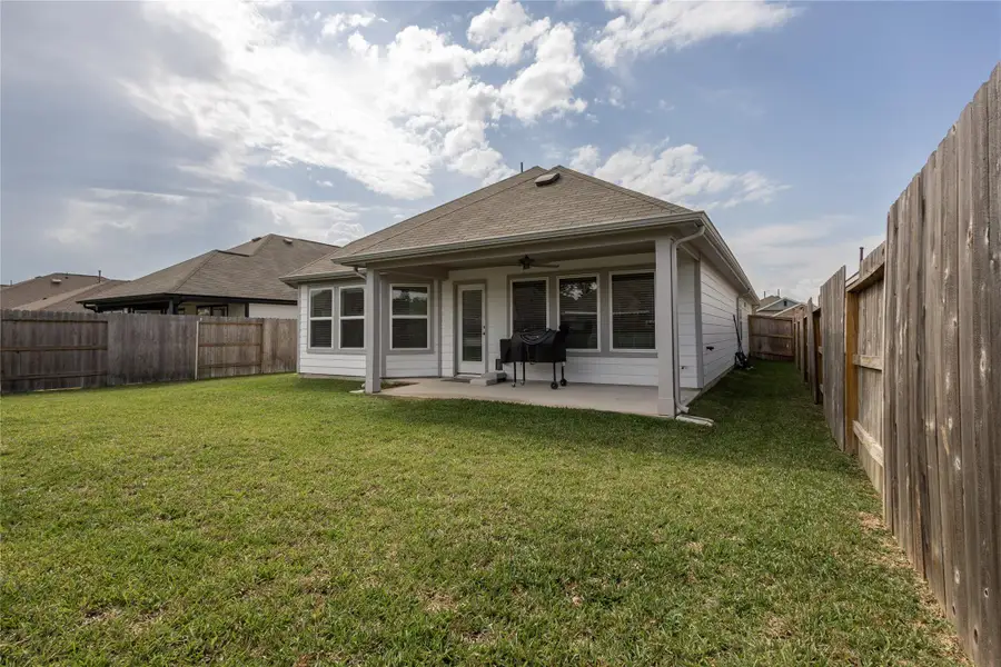 Exterior details and patio area of a home in Pinewood at Grand Texas, New Caney (Image 4).