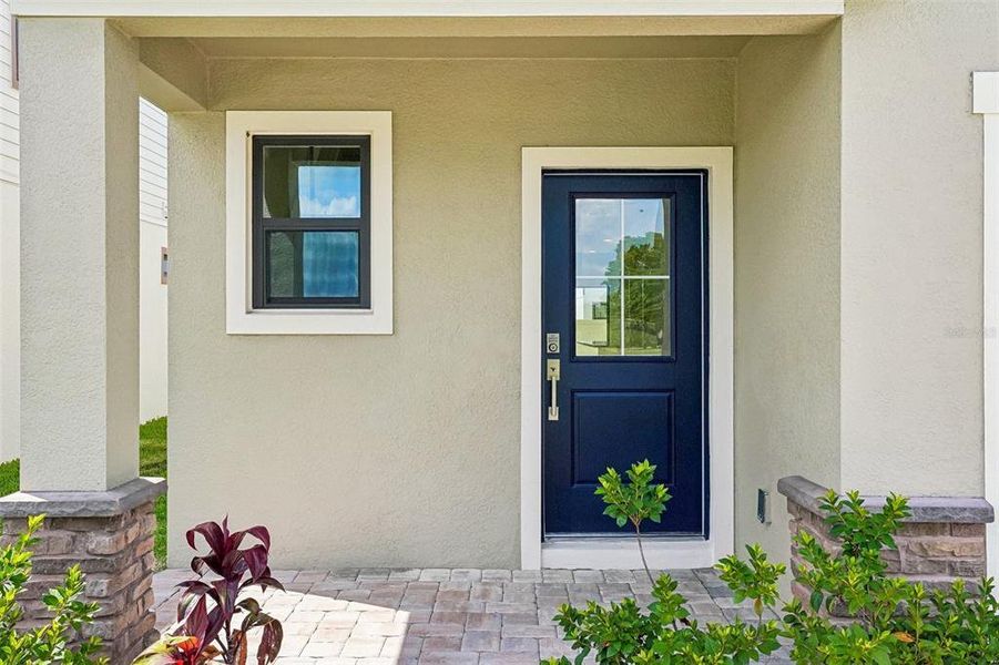 Exterior details and patio area of a home in Grasslands West, Lakeland (Image 4).
