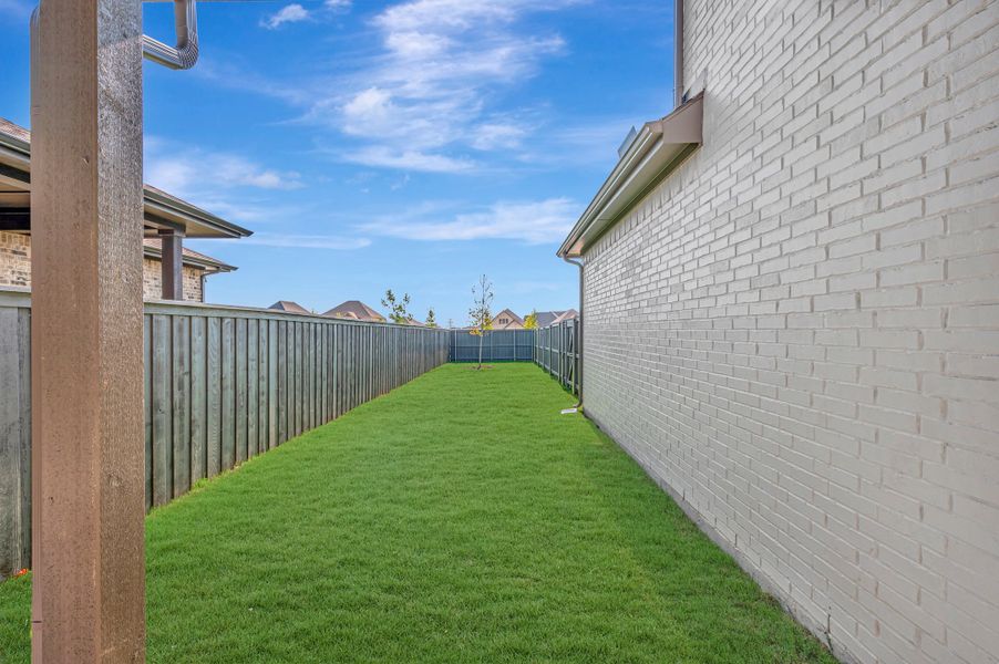Exterior details and patio area of a home in Goodland – Garden Series, Grand Prairie (Image 3). Exterior details and patio area of a home in Goodland – Garden Series, Grand Prairie (Image 3).
