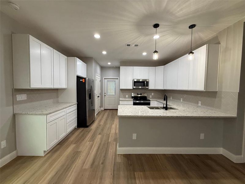 Furnished interior view inside a new home in , Denison (Image 3).