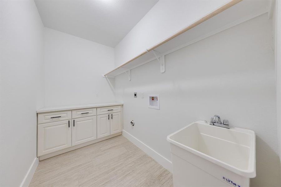 Conveniently located utility room inside the house, offering easy access for laundry and additional storage space.