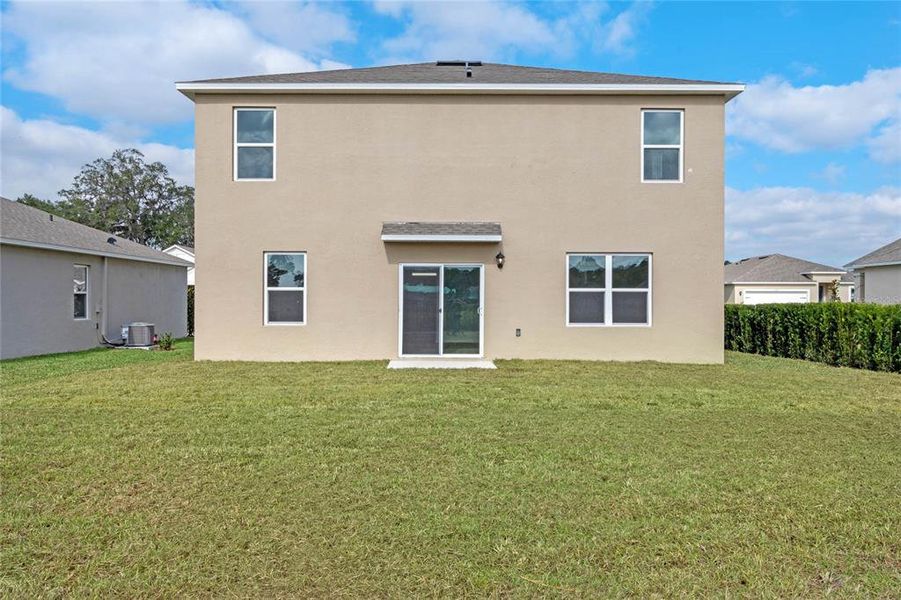 Exterior details and patio area of a home in Windrose, Apopka (Image 1).